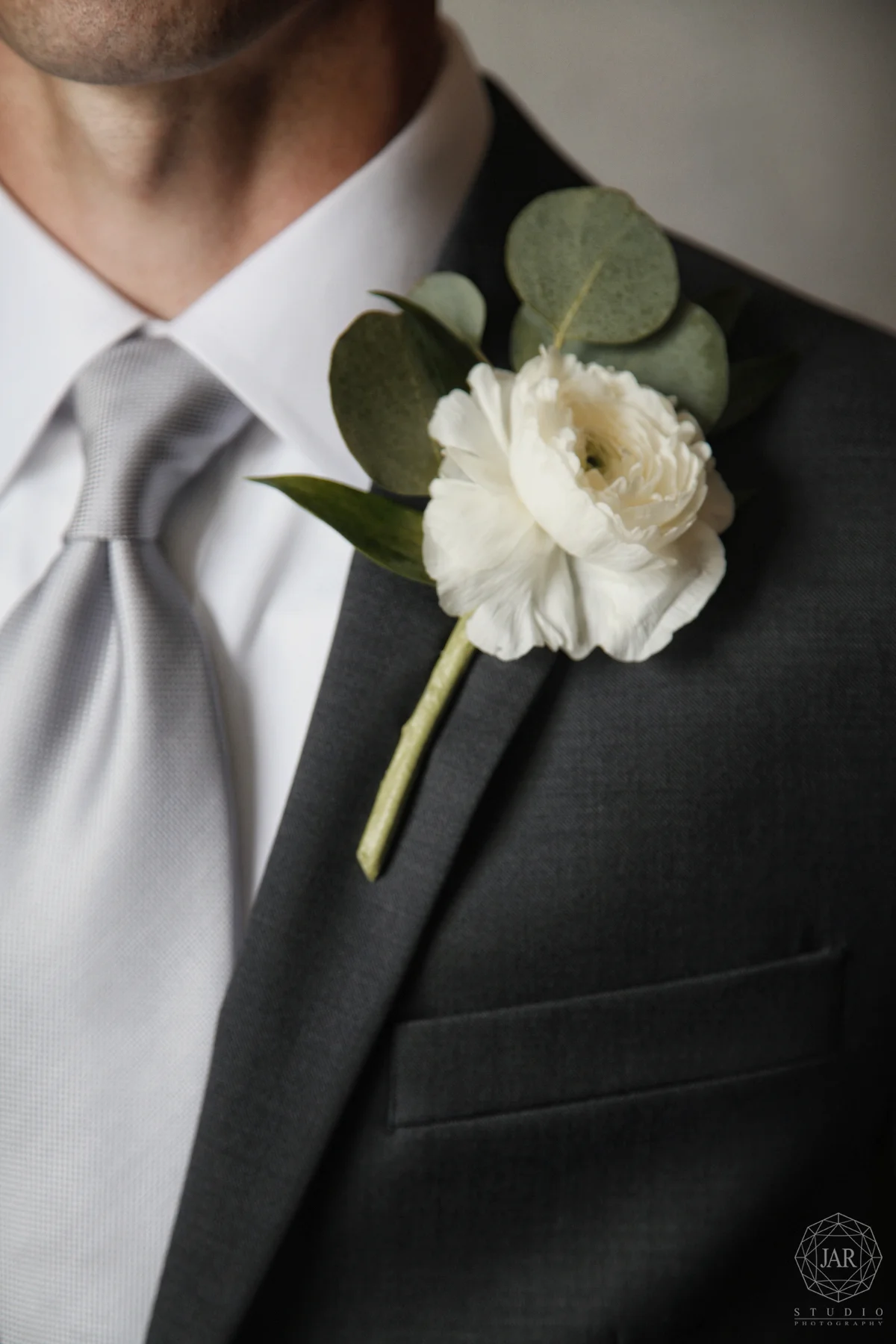 09-white-ranunculus-and-eucalyptus-grooms-boutonniere-jarstudio-orlando-photographer.JPG