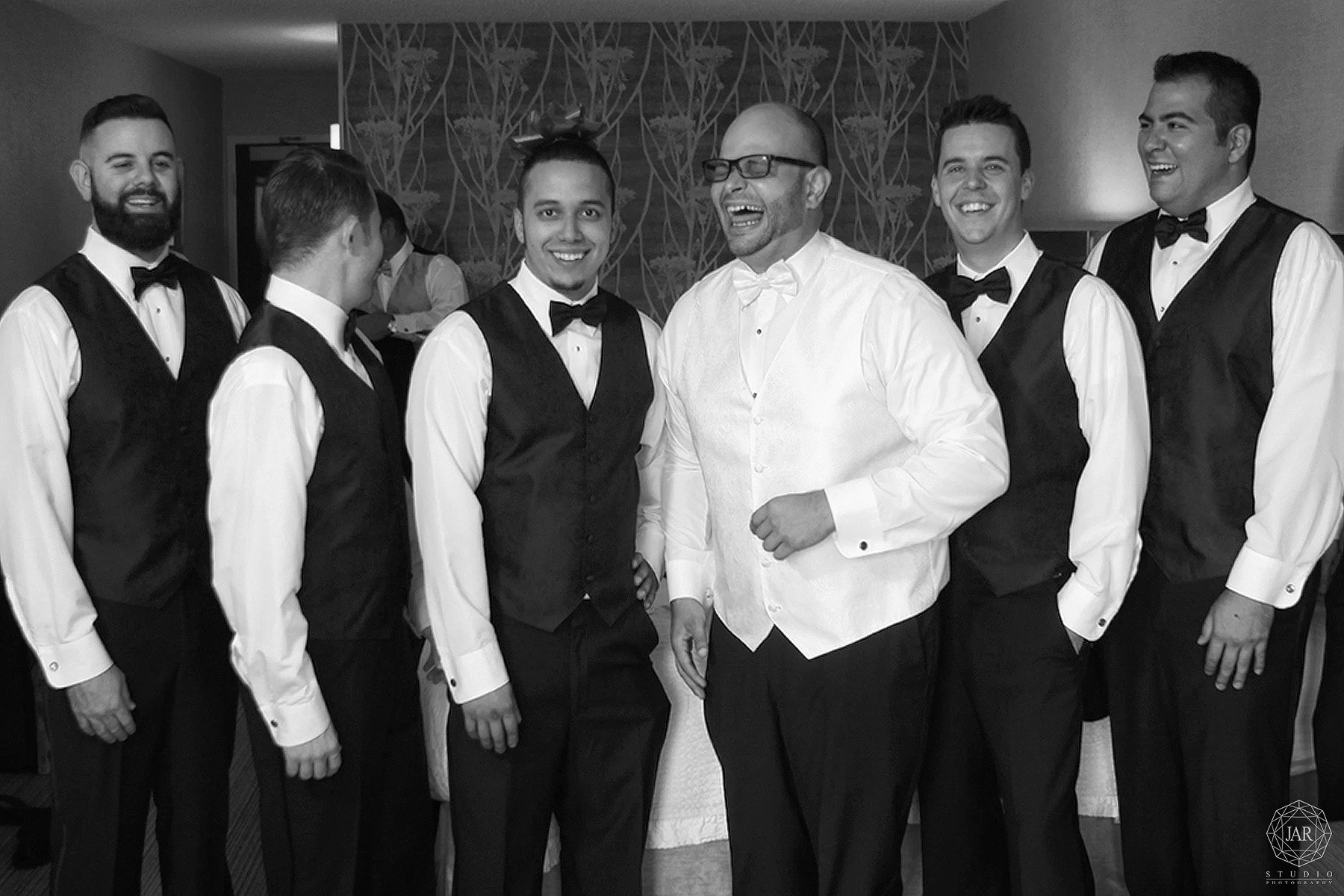 03-groom-getting-ready-fun-with-groomsmen-photographer-orlando.JPG