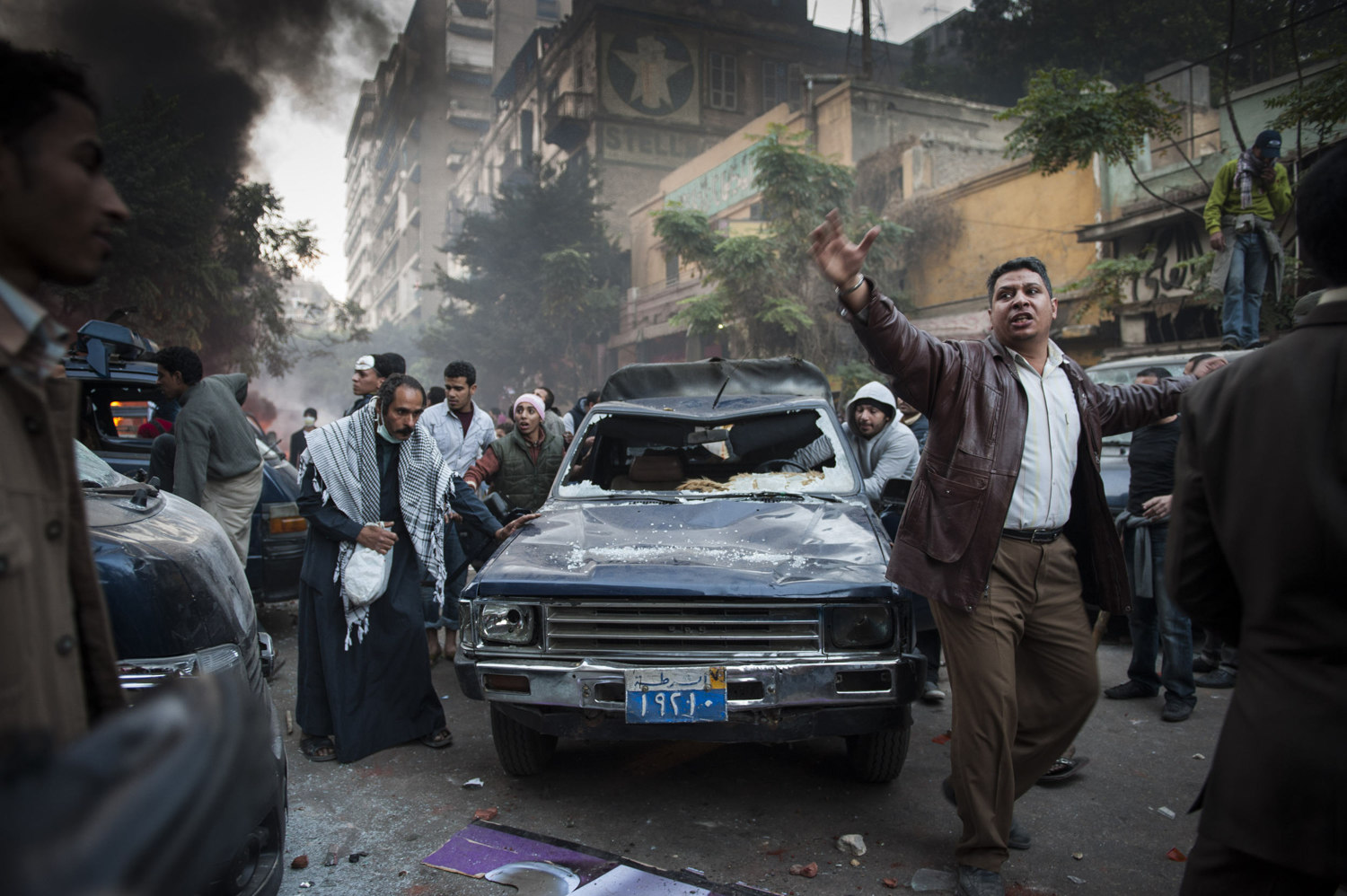  Protesters trash a police vehicle as a sign of the distrust of the government and violence inflicted by police members in Cairo, Egypt. 