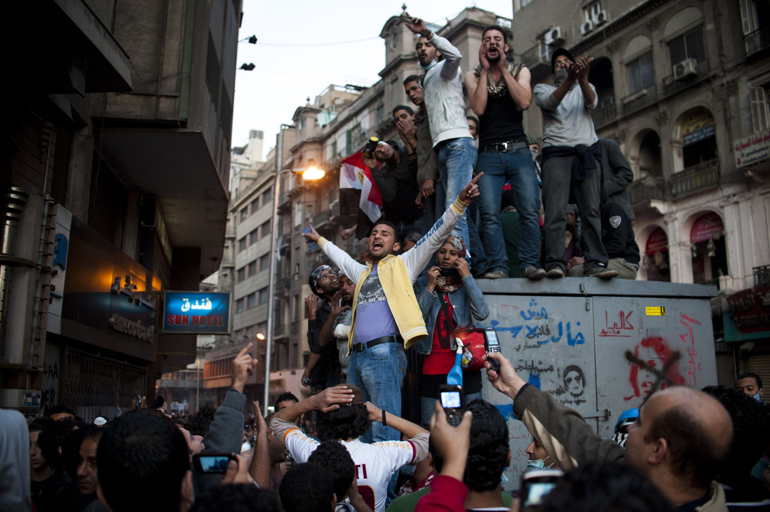  A group of youth's stand and sing revolutionary songs to onlookers on November 22nd 2011. 