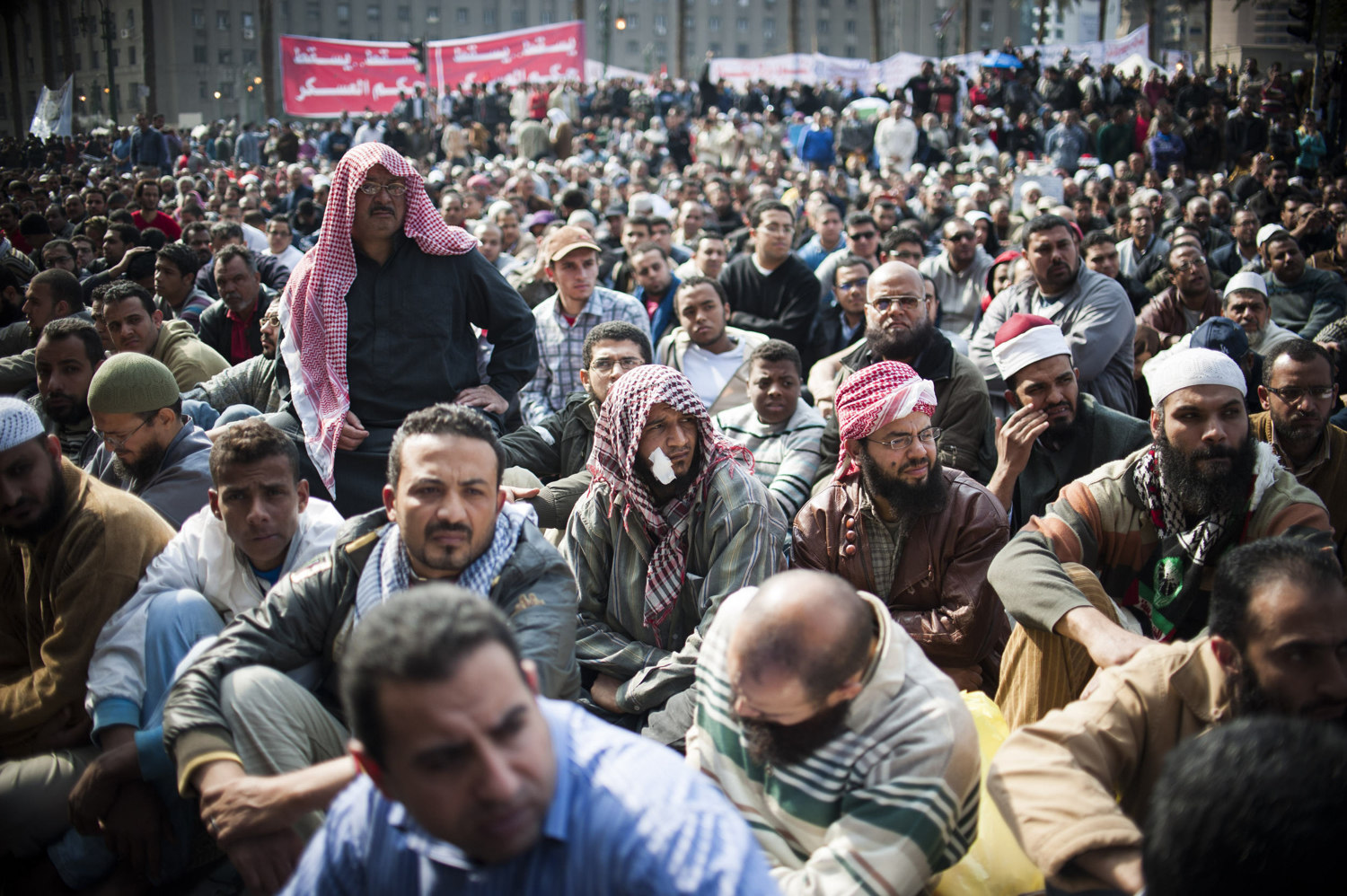  Men listen during Friday's prayers in Tahrir Square on November 25th, 2011. 