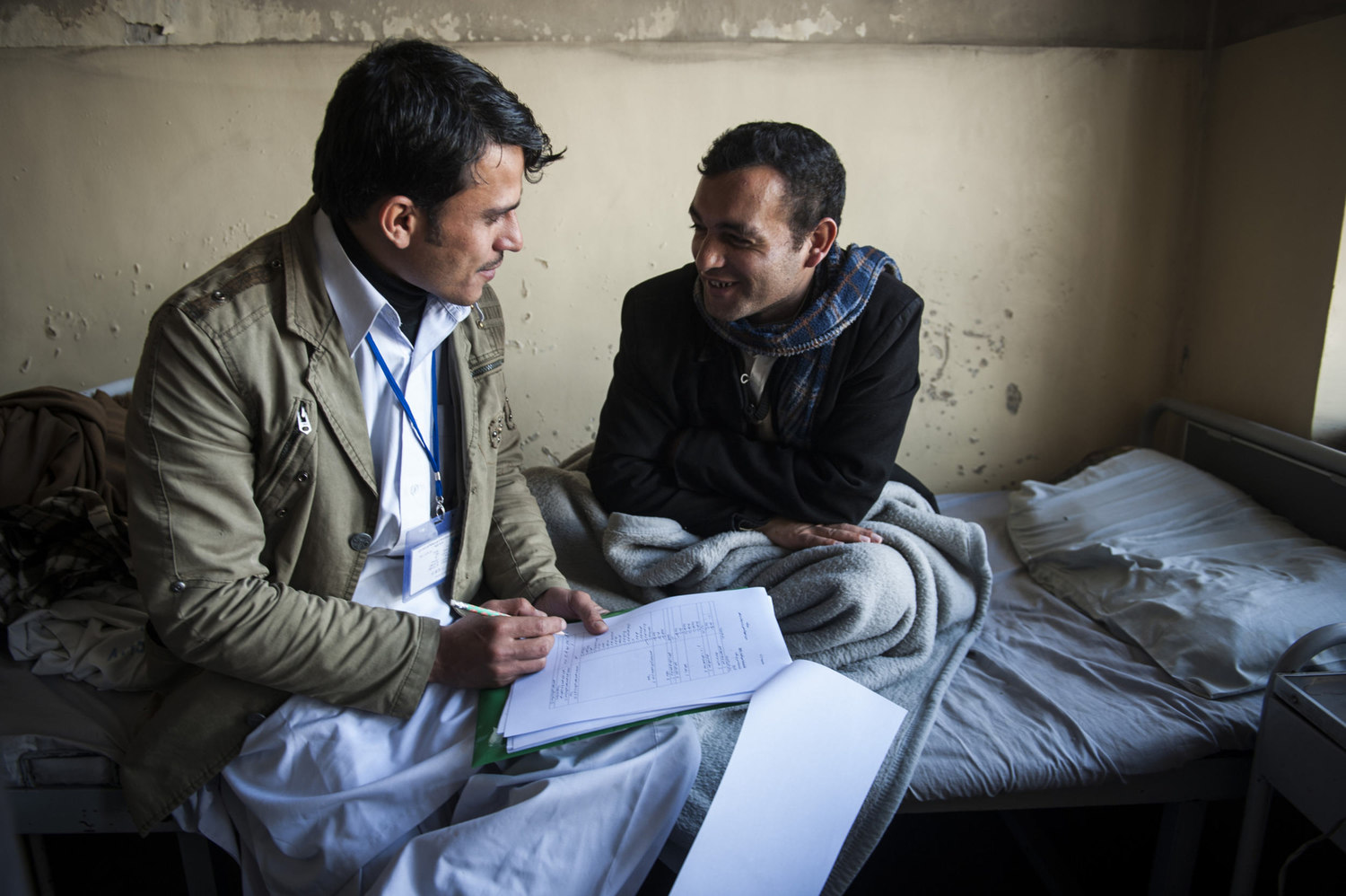  Safikola, A JICA worker at the Ministry of Public Health questions patients about the availability of mental care in their area, their condition, what type of meds is he/she is on and how long they are at the facility. 