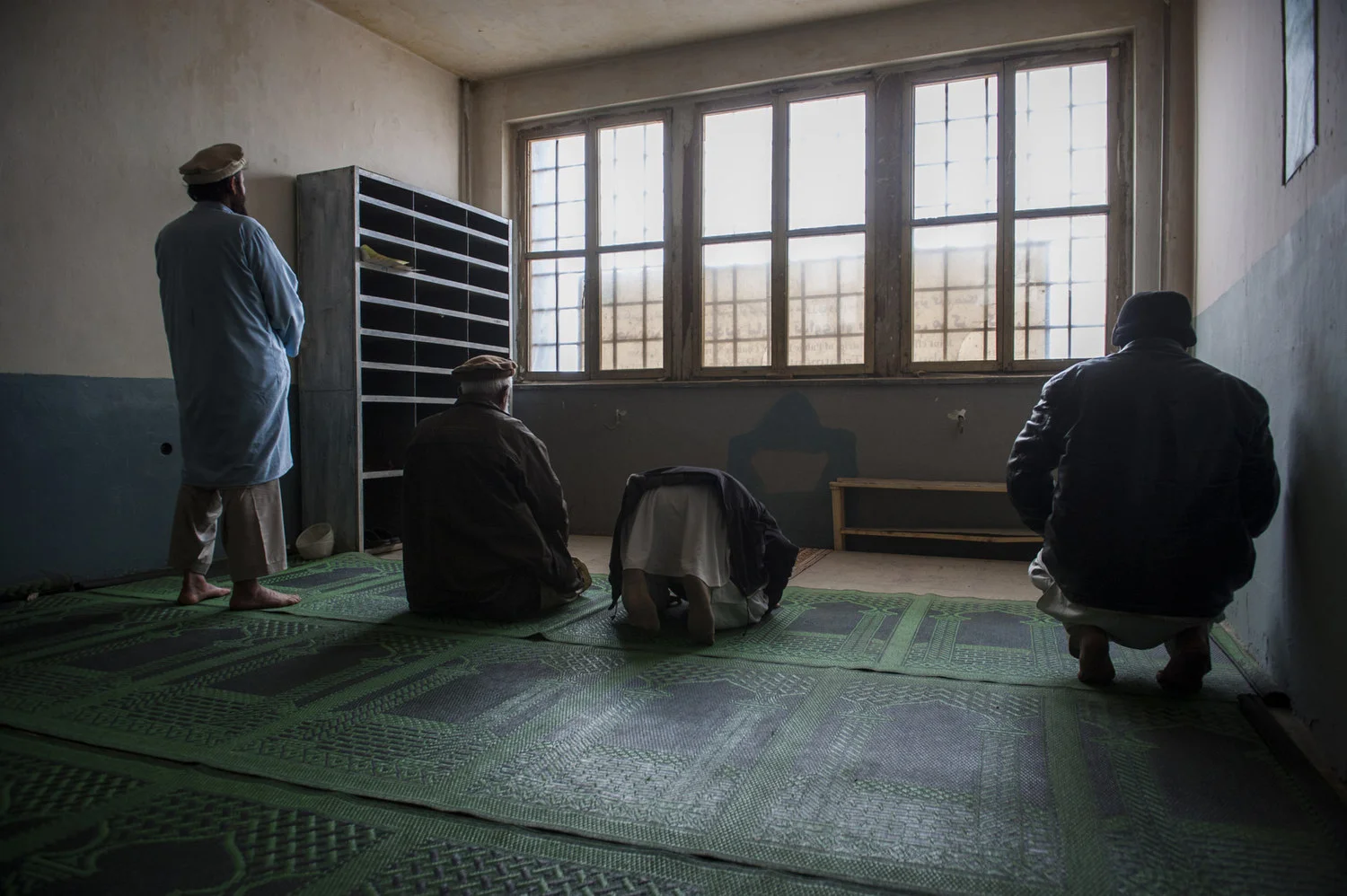  Recovering addicts in the Jangaland clinic  pray at midday. Religion is emphasized as a large part of the healing process  and recovering from their pasts. Kabul, Afghanistan.  