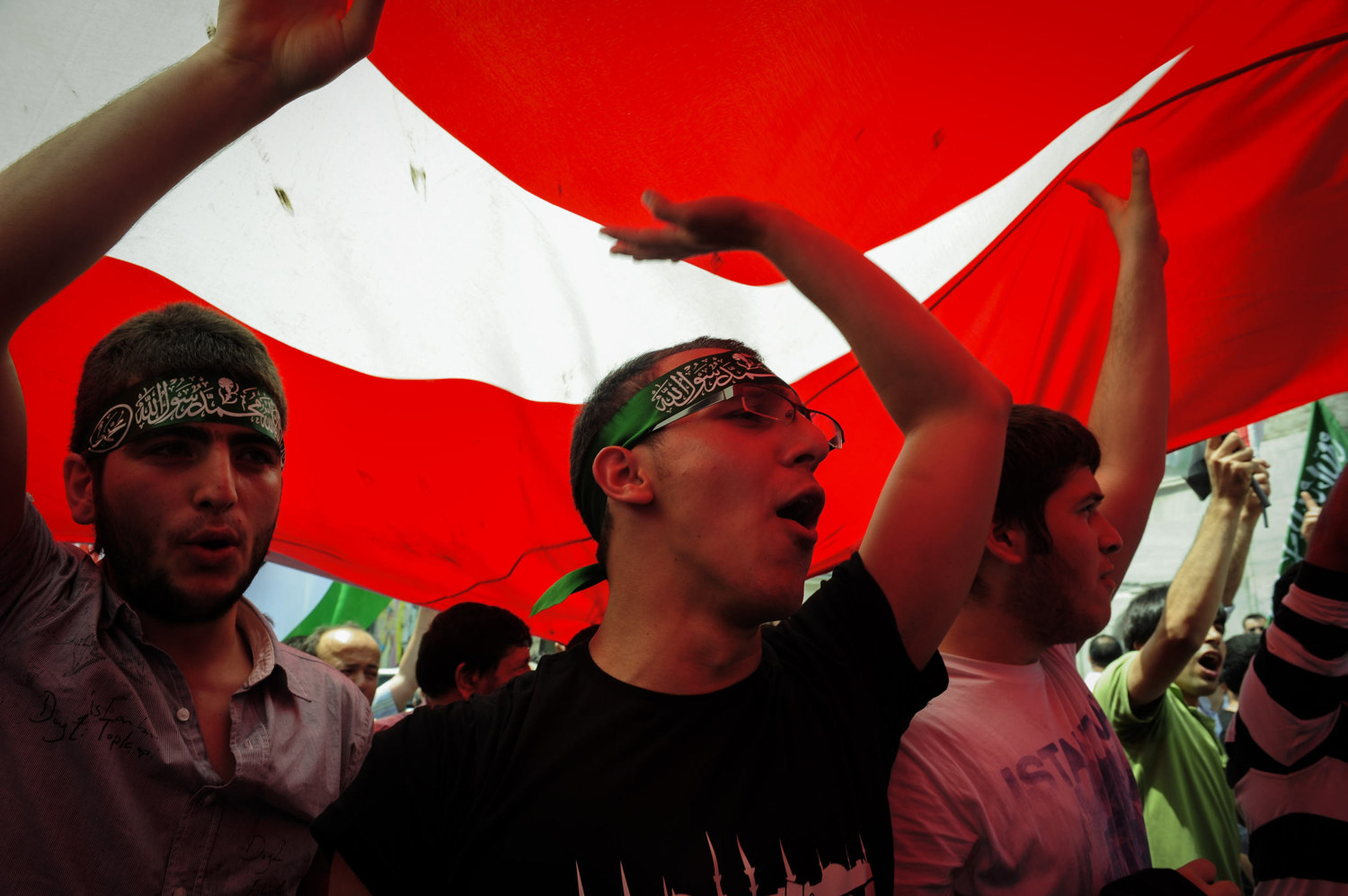  Turkish youth demonstrators shout slogans and burn Israeli flags during an anti-Israeli protest in Taksim Square in Istanbul on May 31, 2010. After the Israeli raid on the "Mavi Marmara" a Turkish ship carrying aid to Palestine nine activists were k