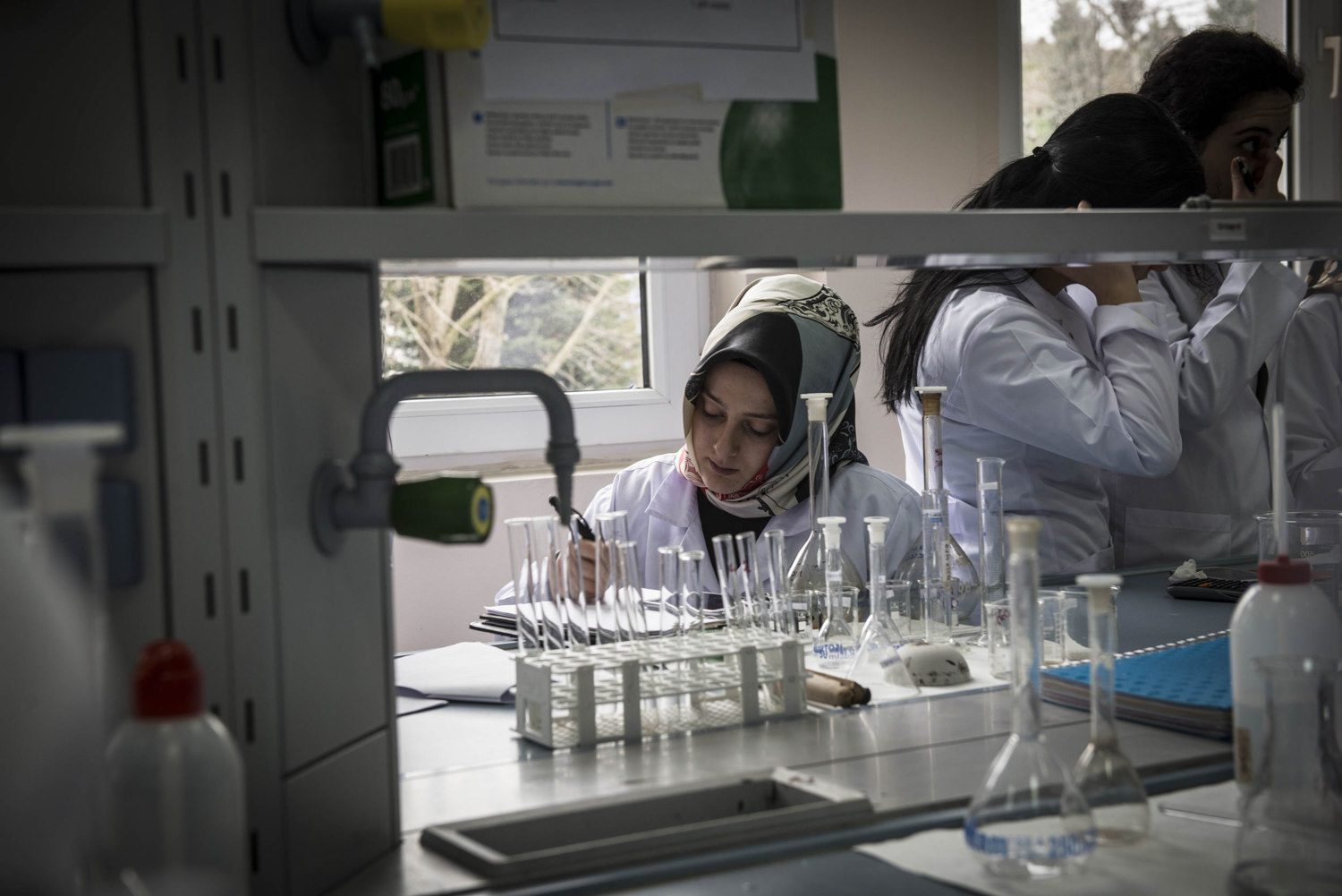  At Istanbul's Fatih University student completes a Chemistry experiment. 