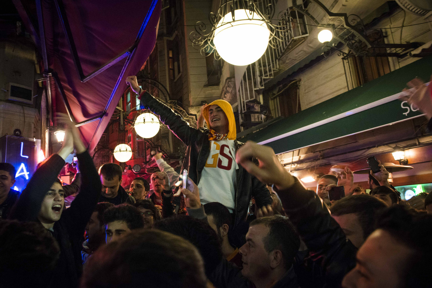  Fans cheer on a win from Football club Galatasaray. 