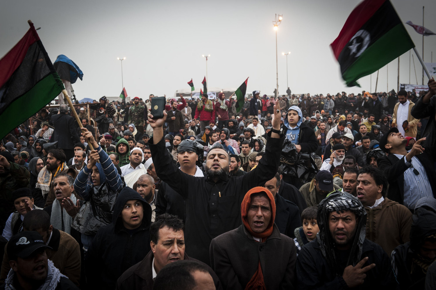  During Friday Prayers in front of  Benghazi's downtown courthouse, men and women pray for safety and for the end of Gaddafi's reign. After a violent battle, the resistance members in Benghazi overtook city and set up an interim government based in t