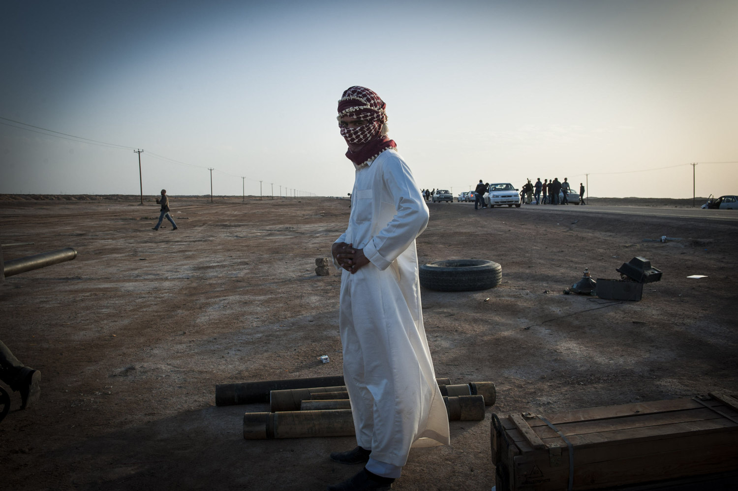  A rebel fighter stands next to empty cartons of ammunition.  Rebel troops are largely made out of volunteers and do not know much about the military or weaponry. 