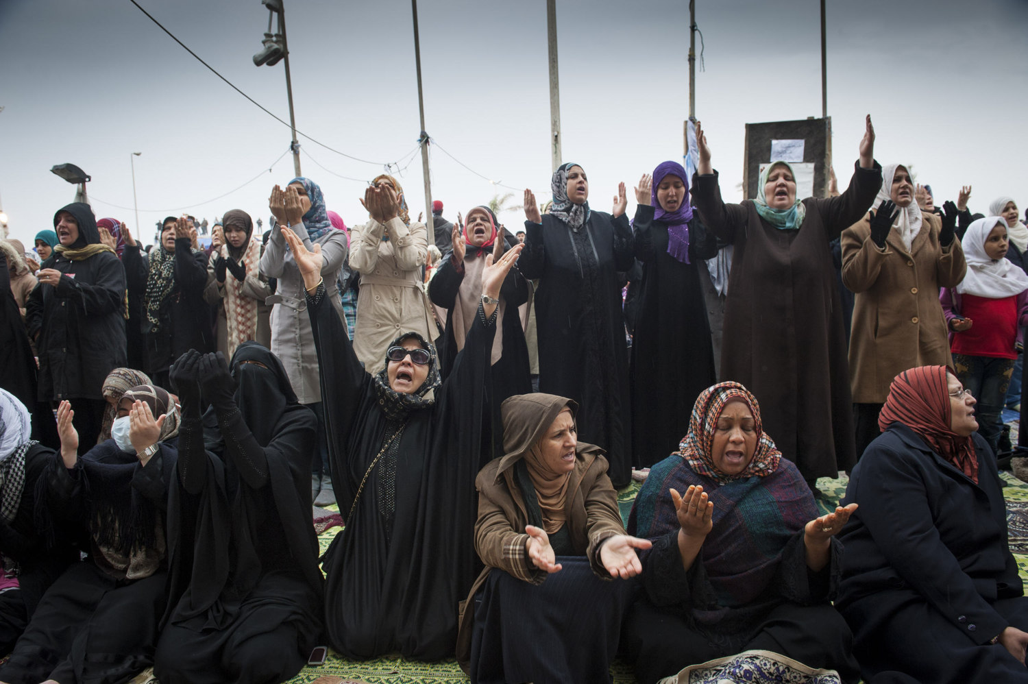  Groups of women pray during Friday Prayers in front of  Benghazi's downtown courthouse, men and women pray for safety and for the end of Gaddafi's reign. After a violent battle, the resistance members in Benghazi overtook city and set up an interim 