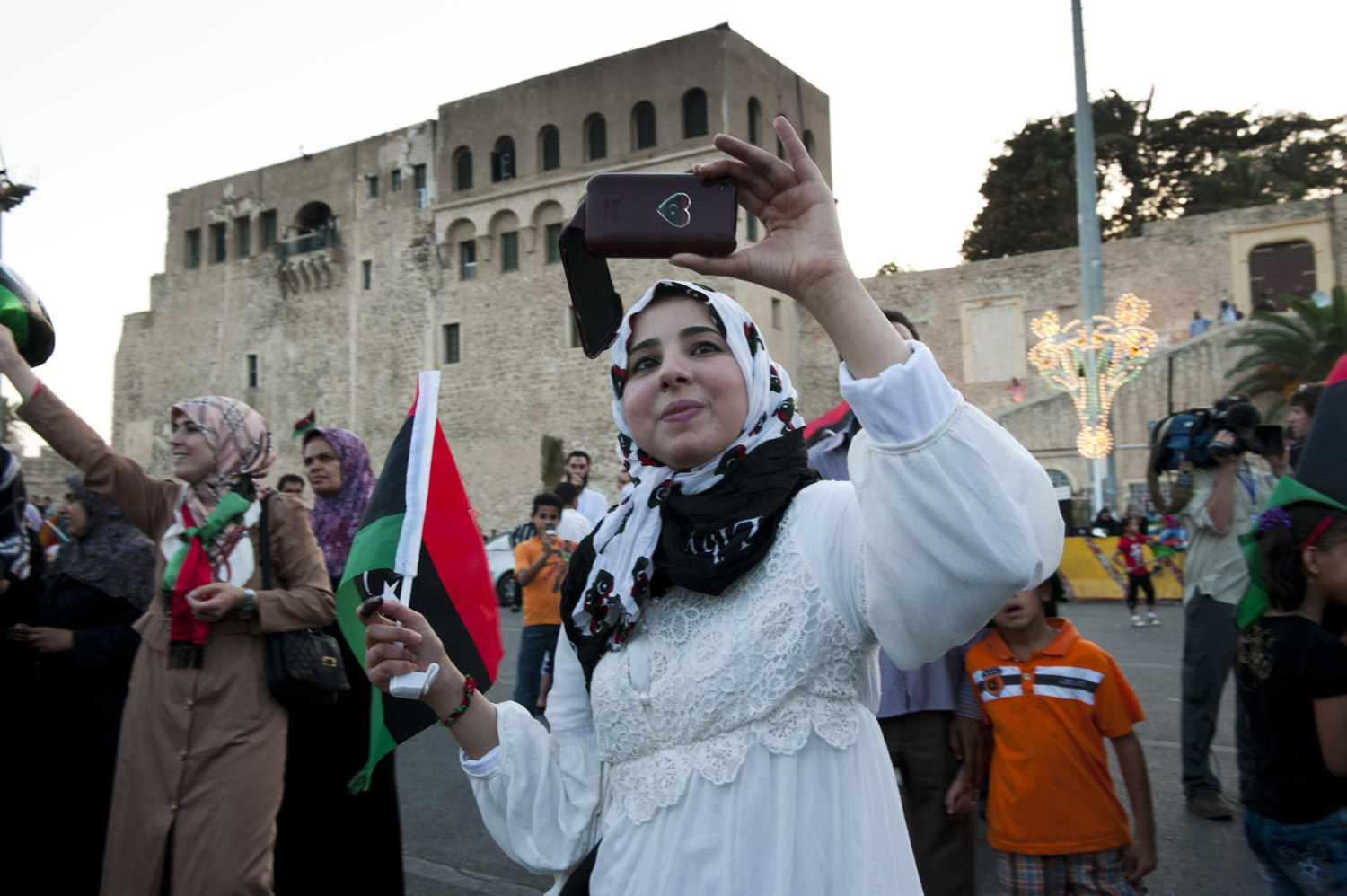  Libyans celebrate after voting in Martyr's Square after voting. Formally called Green Square, where Col. Gaddafi would make yearly speeches.&nbsp; 