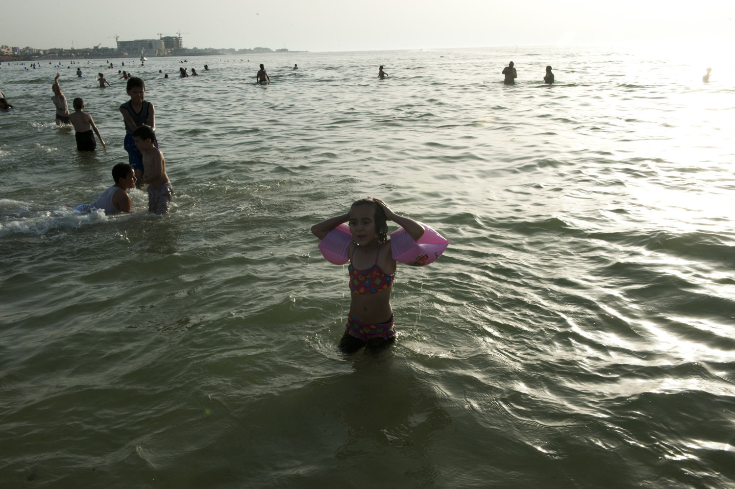  A girl surfaces after swimming in the ocean in downtown Tripoli on July 1st, 2012.

 