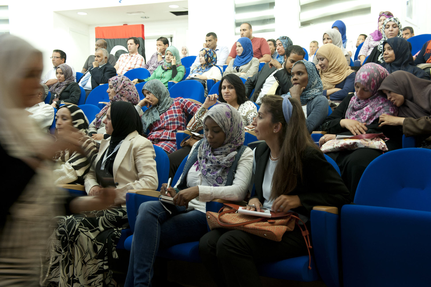  Women take notes during the Libyan International Women's Organization meeting in Tripoli on July 11th, 2012.
 