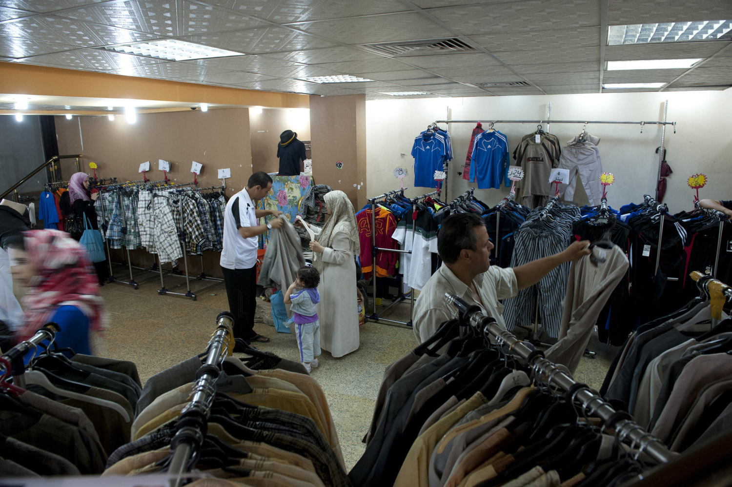  A family shops for clothing in a shopping mall in Souq Al-Jum'a in Tripoli on July 10th 2010.

 