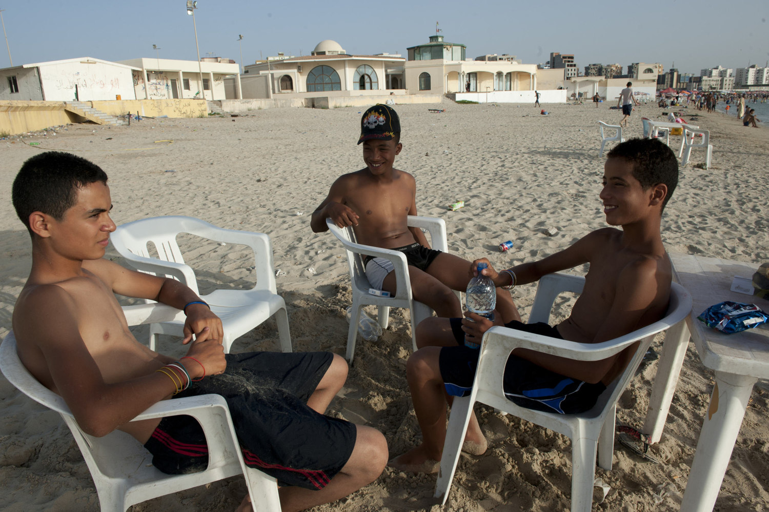  Boys escape the summer heat by going to the ocean in downtown Tripoli on July 1th, 2012

 