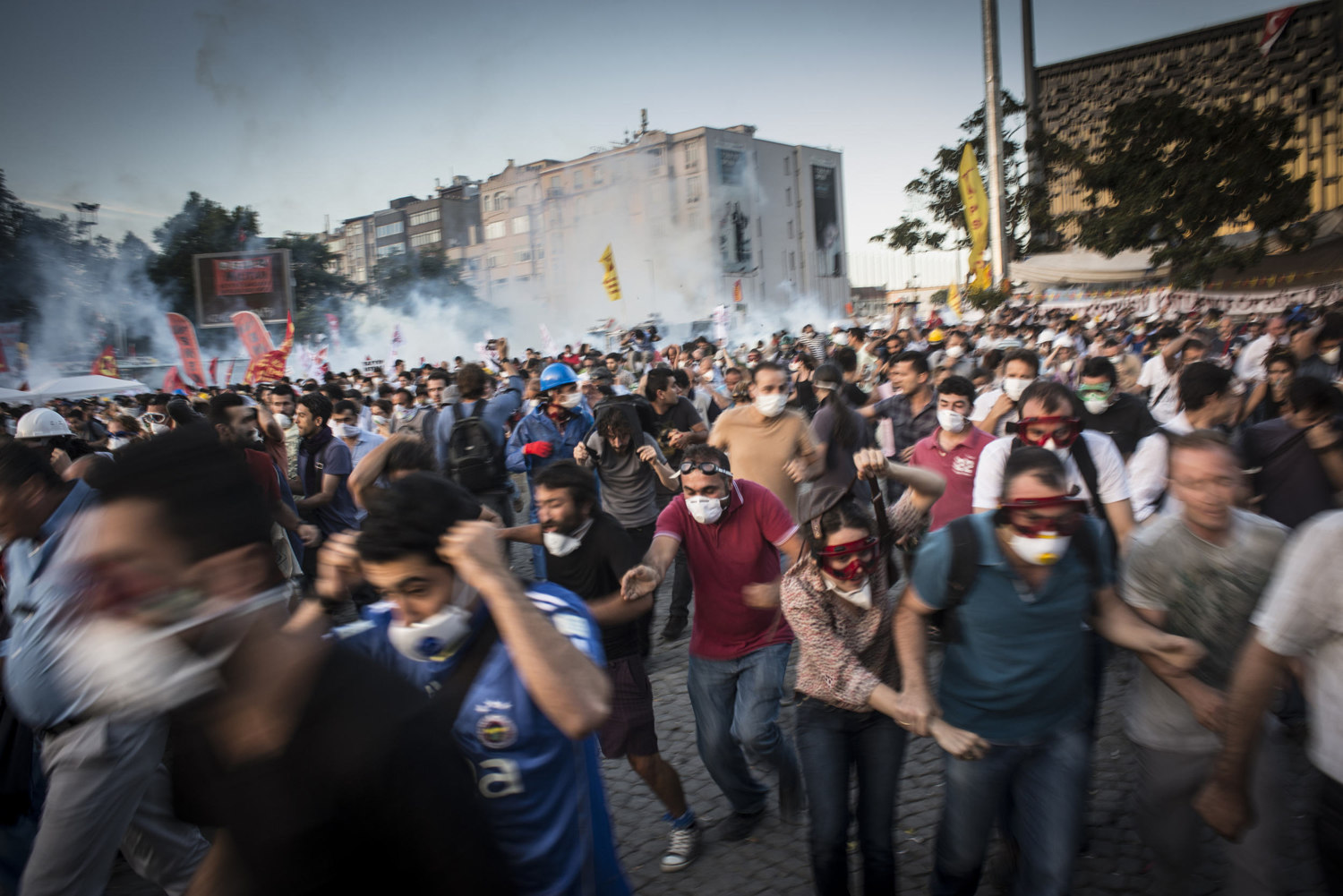  As clashes turn violent, demonstrators run from the police. 
As the police attempt to clear Taksim square, violence breaks out on June 11, 2013. 