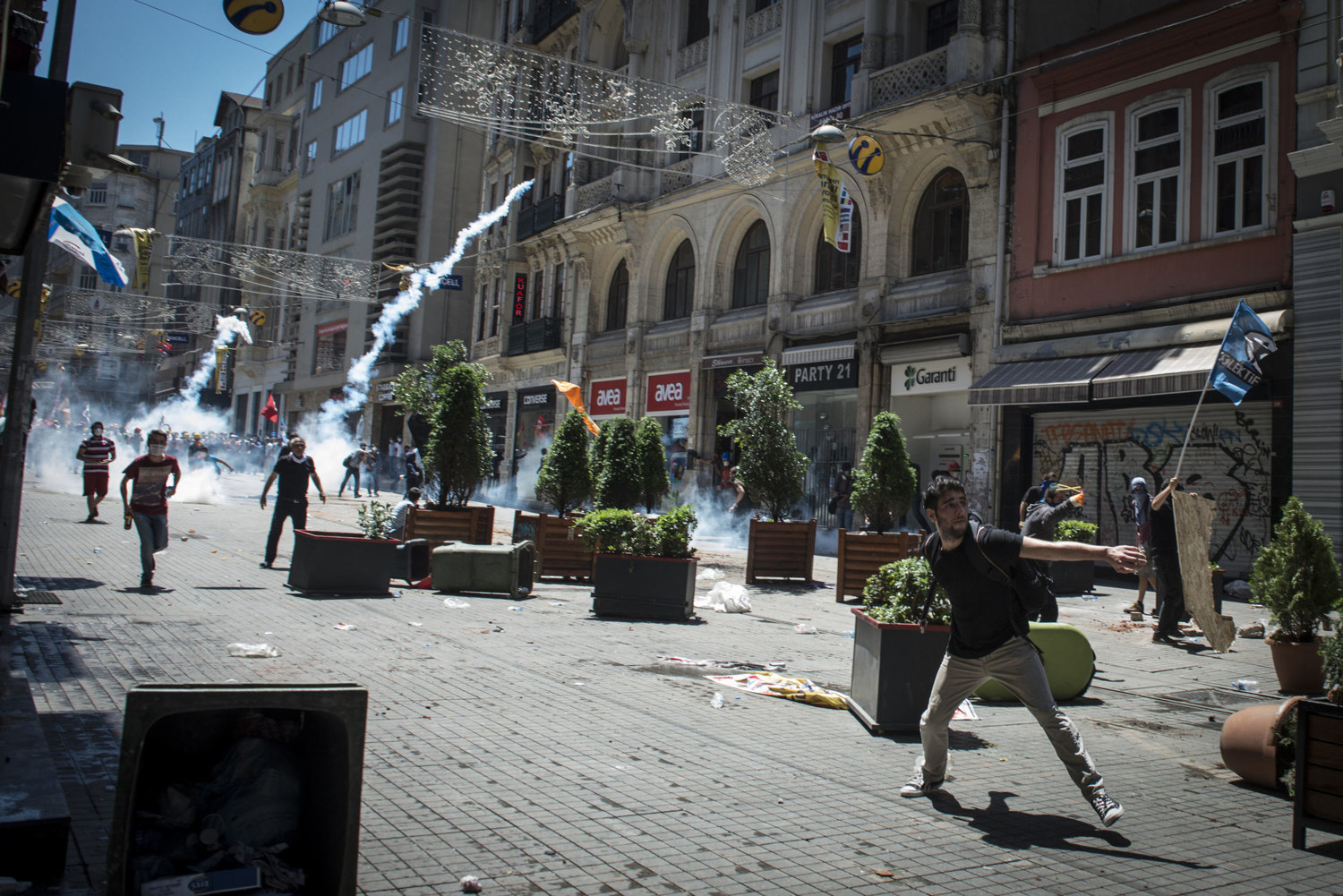  On one of the first days of the protest June 1 2013, demonstrators throw rocks and molotov cocktails at the police on the busy shopping street known as Istiklal Cadessi, in Istanbul Turkey. 