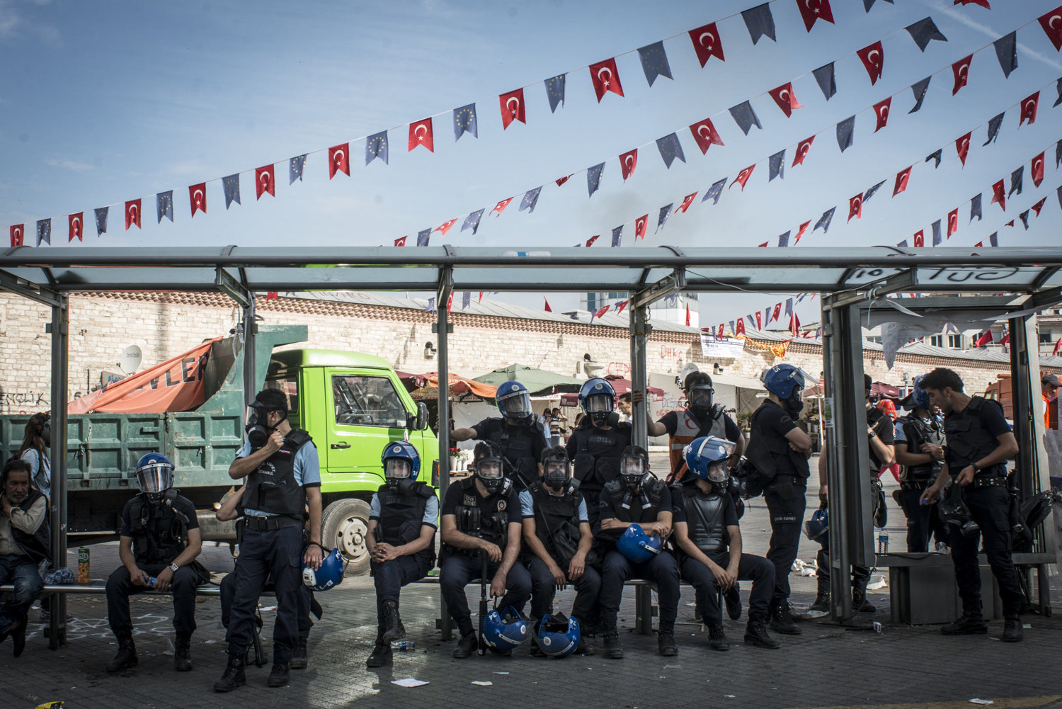  Police rest between demolishing barricades built by the protestors on the morning of June 11, 2013.
After hours of tear gassing and TOMA tanks (armored vehicles that spray a mix of water and tear gas) the protestors managed to momentarily re-take th