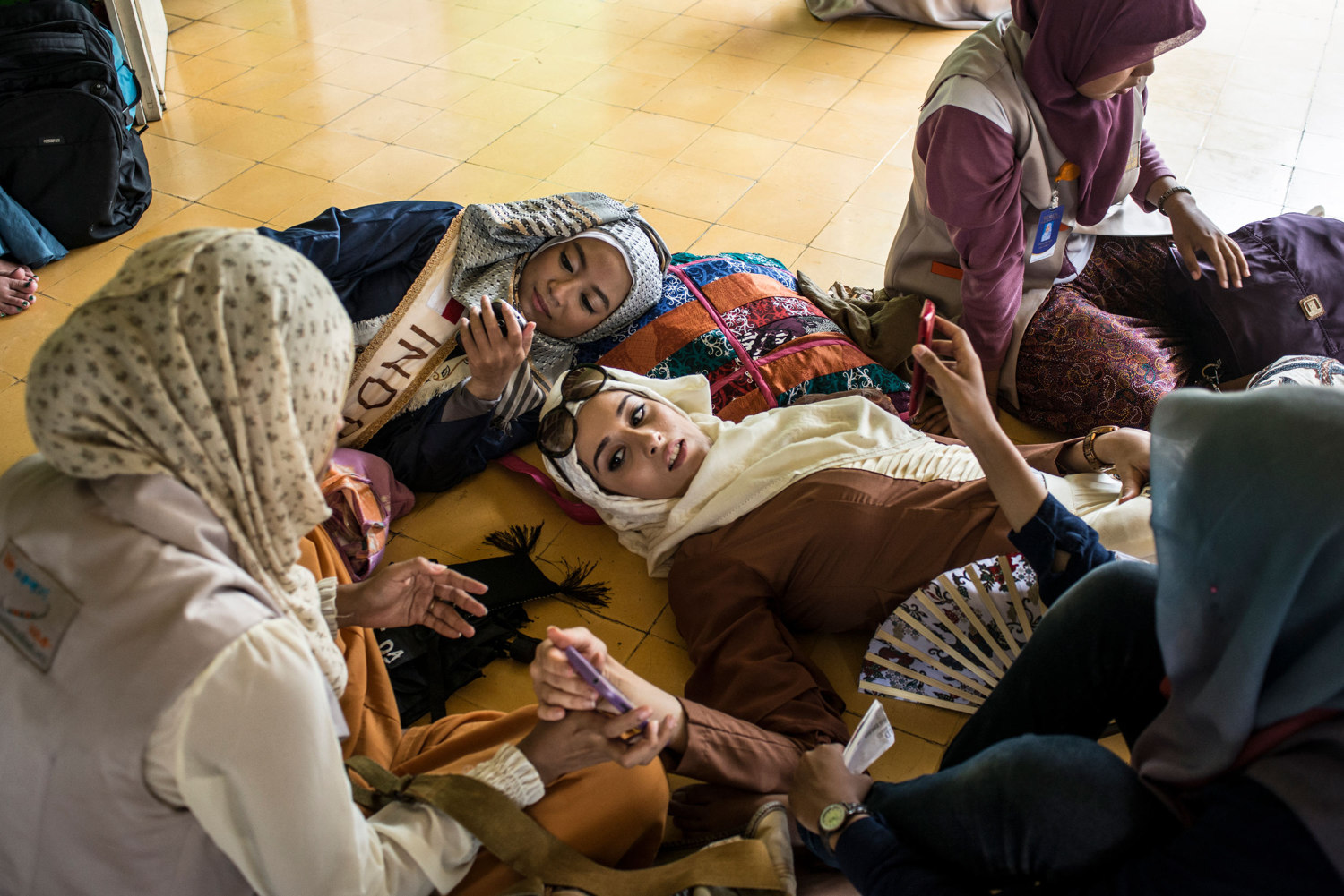  Fatma Ben Guefrache, the finalist from Tunisia and one of the Indonesian finalists rest after praying at a mosque. 