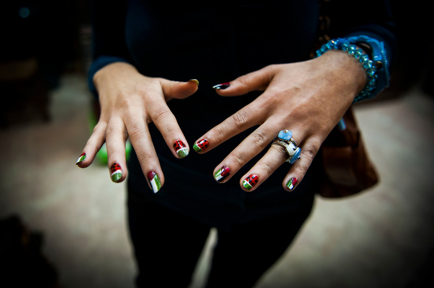  A girl shows off her Palestinian themed nails after a recent bombing campaign. 