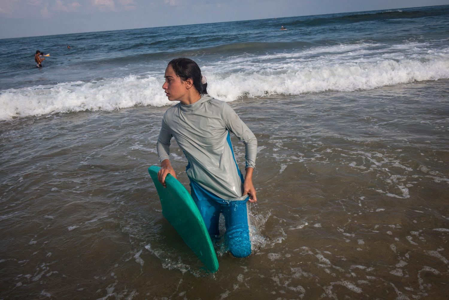  For many Gazans the sea is the only place they can be without being reminded of their isolation. Female Surfer, Sabah Abu Ghanem ,14 and her sister surf early in the morning outside of Gaza city. The sisters place first in many competitions inside t