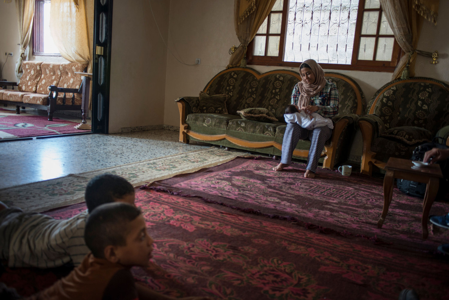  During heavy shelling in the southern city of Rafa, Marwan spends time with her niece, children and extended family who have been evacuated to her house. Three families are now living where one lived previously and there are 60 people in the buildin