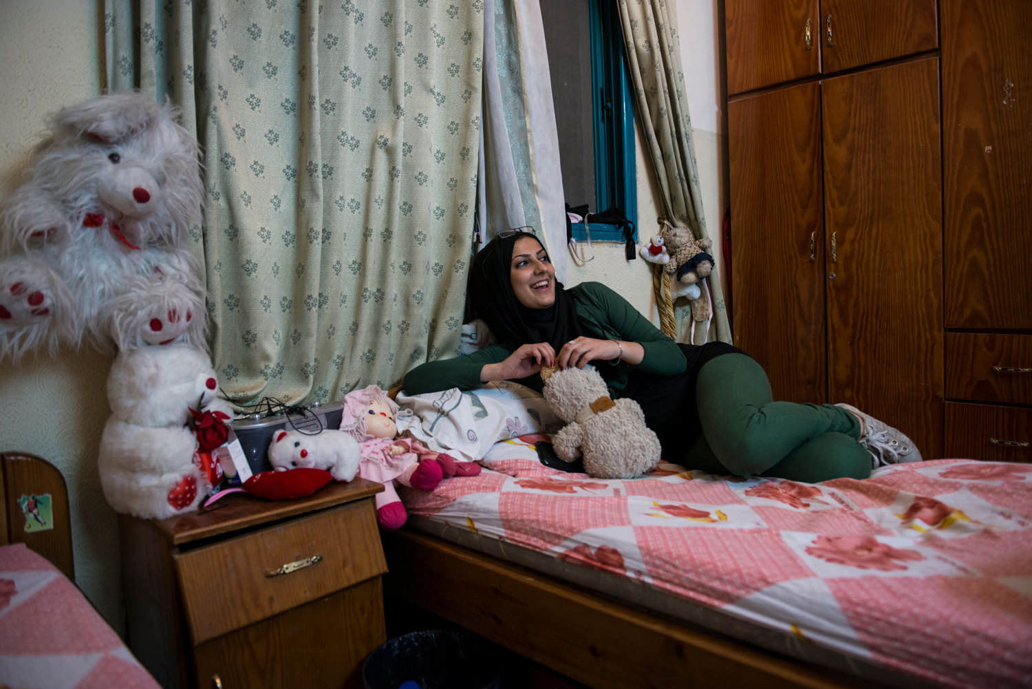  Doaa in a friends bedroom. Girls that are un-married have few places to be themselves. Bedrooms and private cars are sanctuaries where girls can sing and dance without being judged by the public, or their own families. 