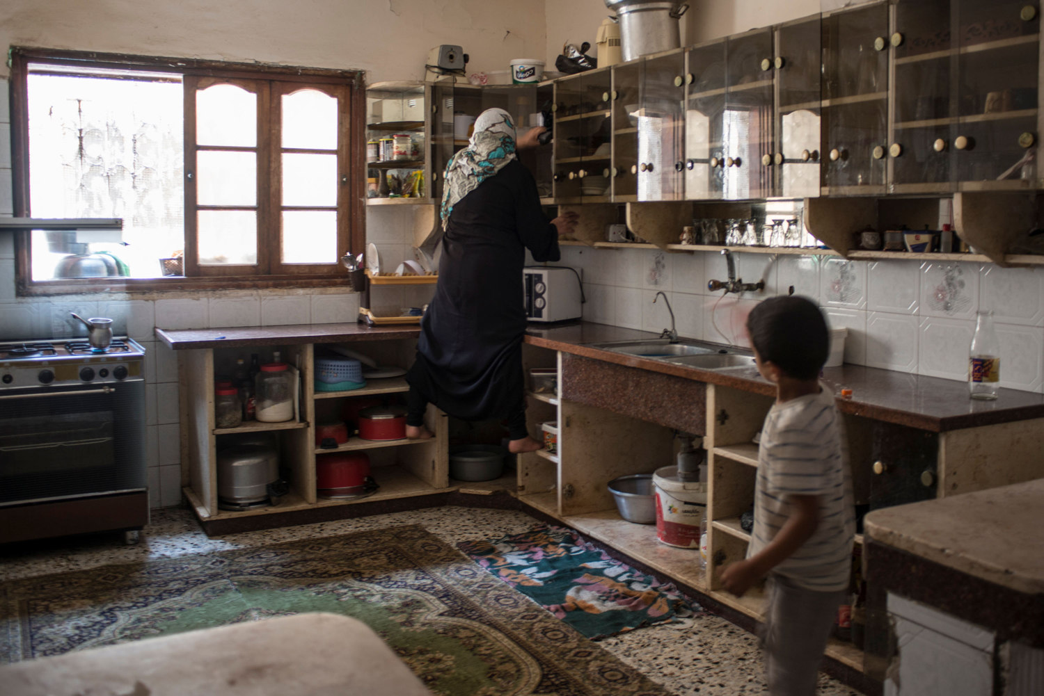  A girl picks through the rubble at what was previously her families home in Beit Hanoun, Gaza. 