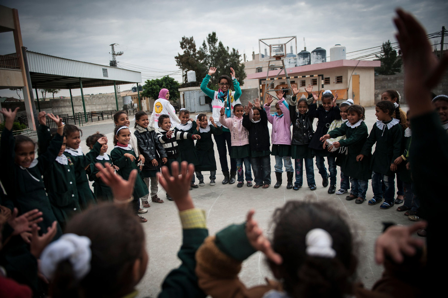  Nisreen Shawa, a worker for the Palestinian Medical Relief Foundation at the Hamza Bin Abd-el Muttalib School where they do art therapy and exercises with girls after the recent bombings. 