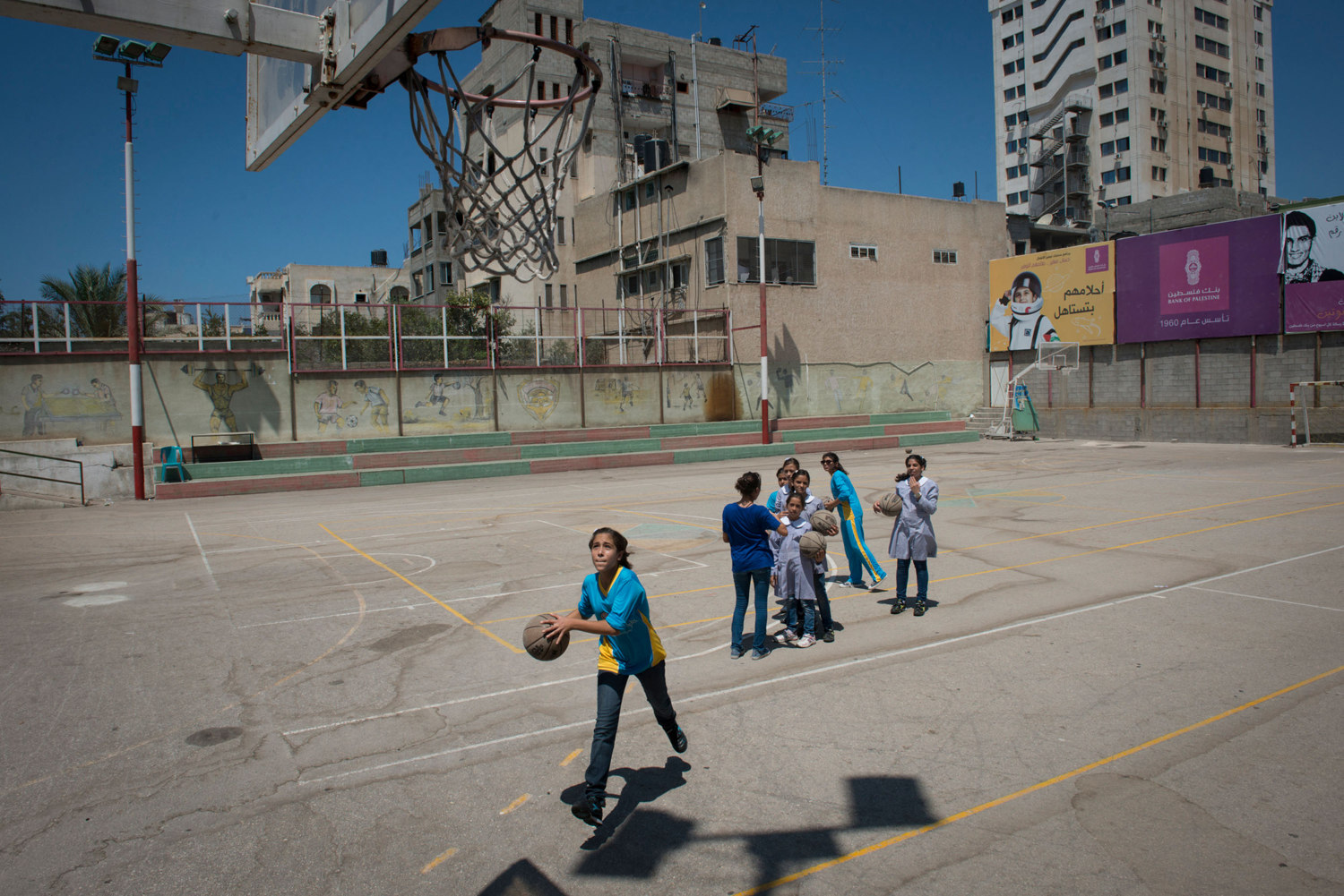  Girls play Basketball at the Gaza Athletic Club, one of the oldest sporting clubs  in the country. The practice is sponsored by PACES, a charity that works to get girls active. Women in Gaza typically do all types of sports till the age of 16, when 