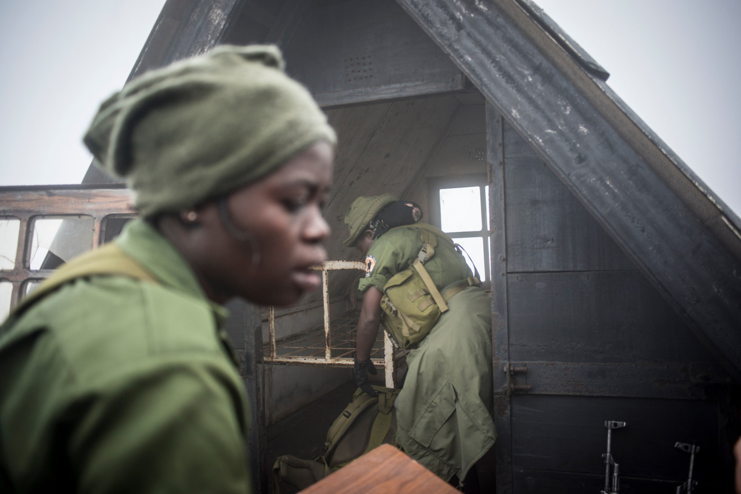  Solange and Francine prepare the rudimentary huts located on the crest of the volcano for the nights camp. 
 