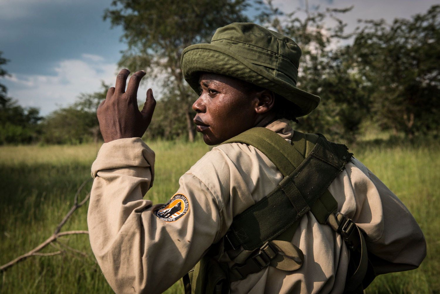  Rangers-in-Training during military style drills in the savannah. Patrols can last up to 6 hours in the scorching heat. Virunga's park guards responsibilities eclipse those of a typical park guard as the area is known to have incidents with local re