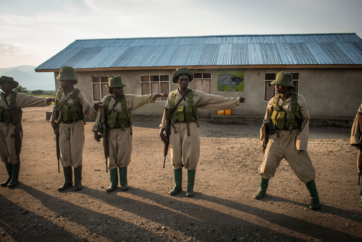  Rangers-in-Training returning to camp after a 4 hour patrol through the savannah. Virunga's park guards responsibilities eclipse those of a typical park guard as the area is known to have incidents with local rebel groups.
 