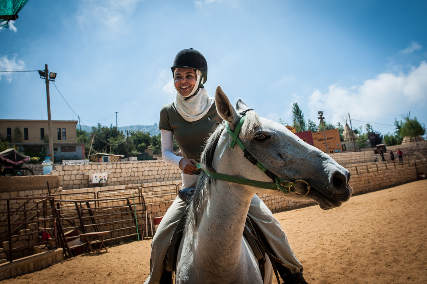  Maya Daher rides a horse at El Rancho, she is visiting with her husband and two children.  