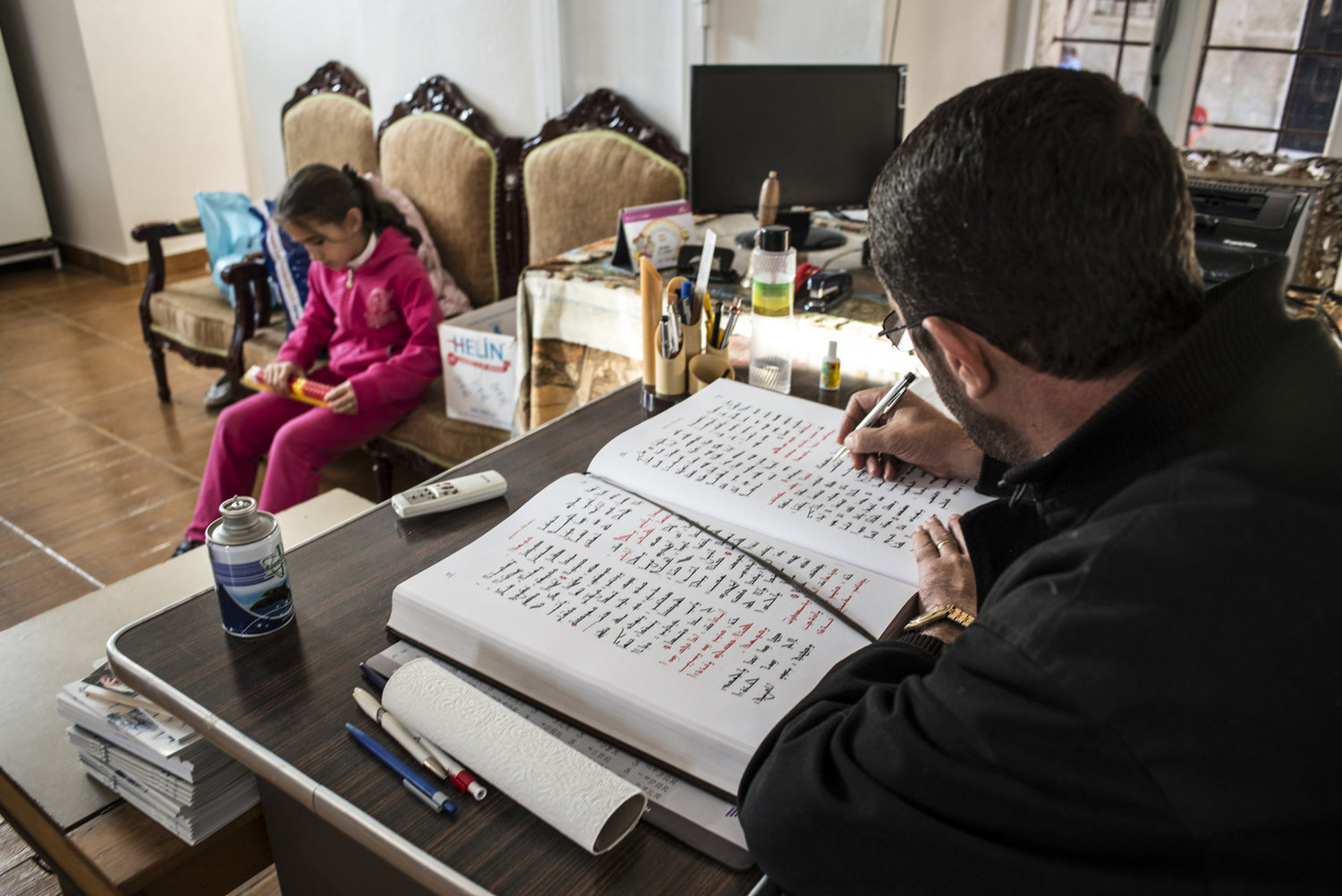  Decon Ayhan Gürkan reads from an Assyriac book before a church service at Mor Barsaumo church on October 31st, 2014.

The Mor Barsaumo church is over 1,500 years old and was renovated in 1943. It is located 21 Şen Caddessi in Midyat, Turkey. 