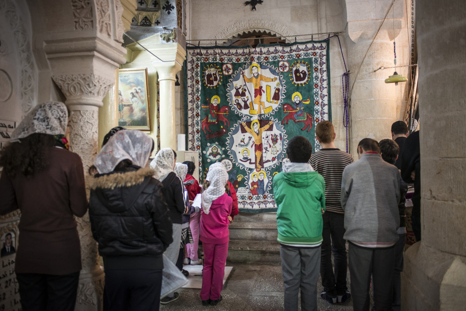  A church service at Mor Barsaumo church on October 31st, 2014.

The Mor Barsaumo church is over 1,500 years old and was renovated in 1943. It is located 21 Şen Caddessi in Midyat, Turkey. 