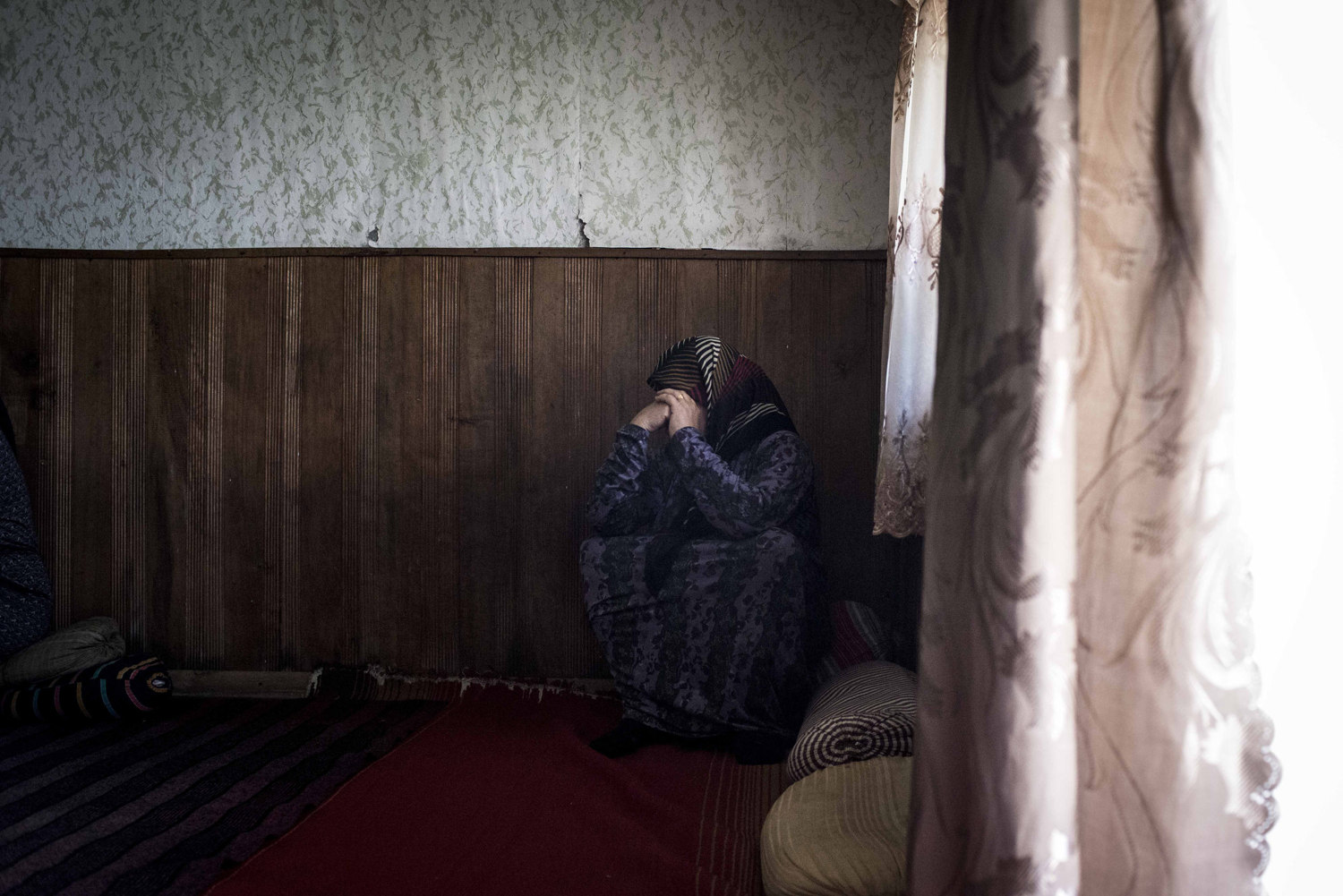  A woman rests after the ceremony

 