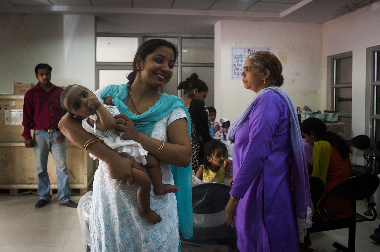  A young mother and her daughter, visit the Gurgaon hospital so the baby can receive typical vaccinations. In India the emphasis on two children per household has caused riffs in many families that already have one girl. 
 