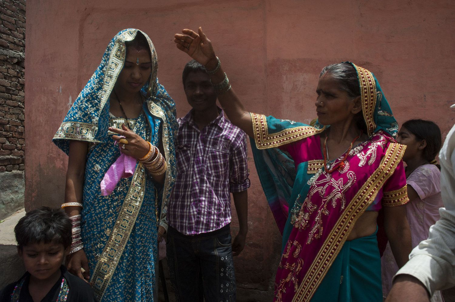  A young woman leaves her home in Mullahera after being married last night- in a traditional ceremony and is brought to her new husbands home. This is the final in a series of many wedding events.  