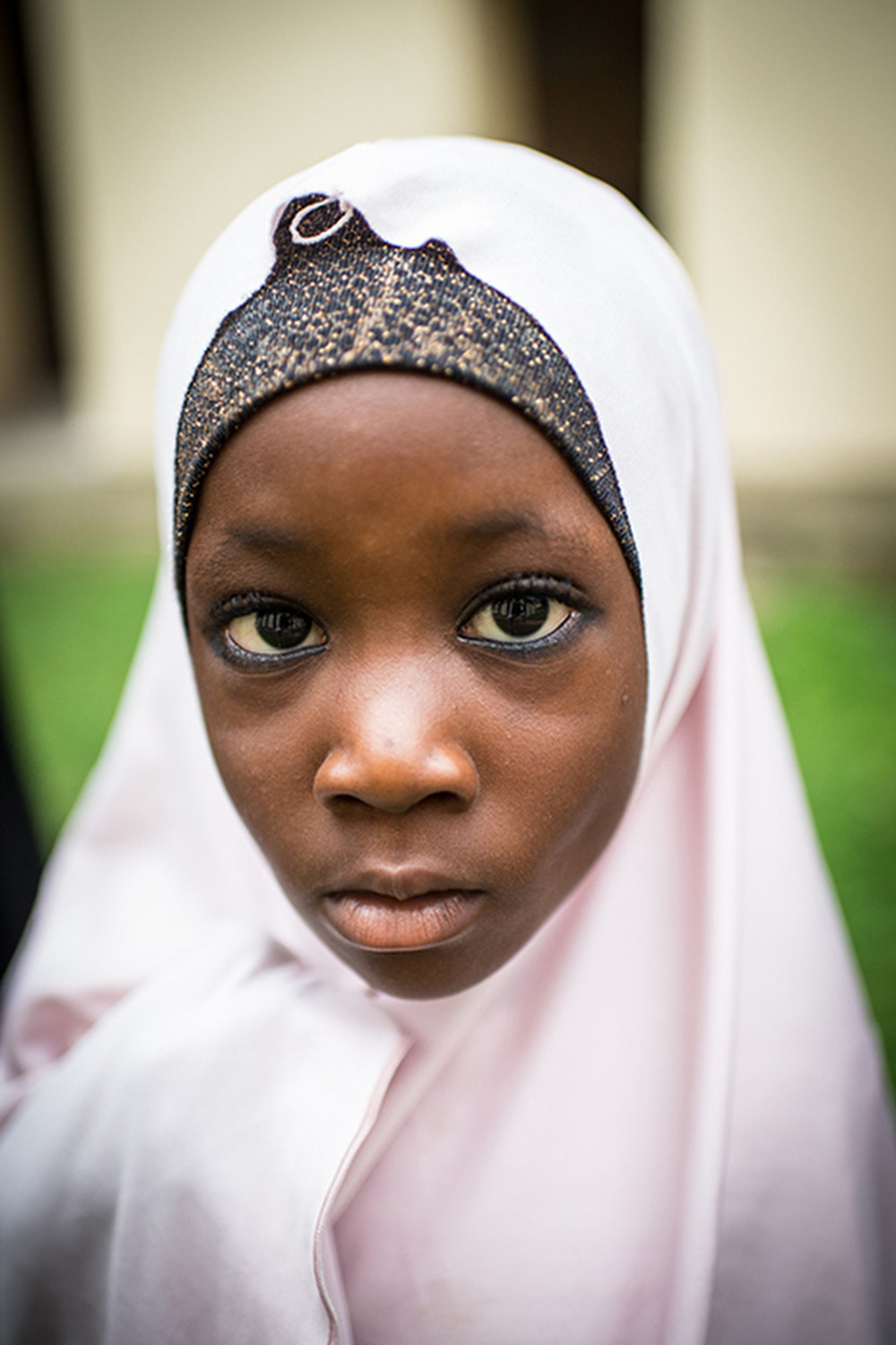 Aisha Hassan who visits the clinic with her mother so she can receive shots for child spacing in Lokoja, Nigeria. 
