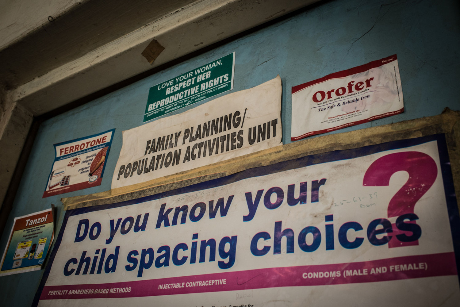  Stickers line the wall at the Family Planning/Population clinic in Lokoja. 