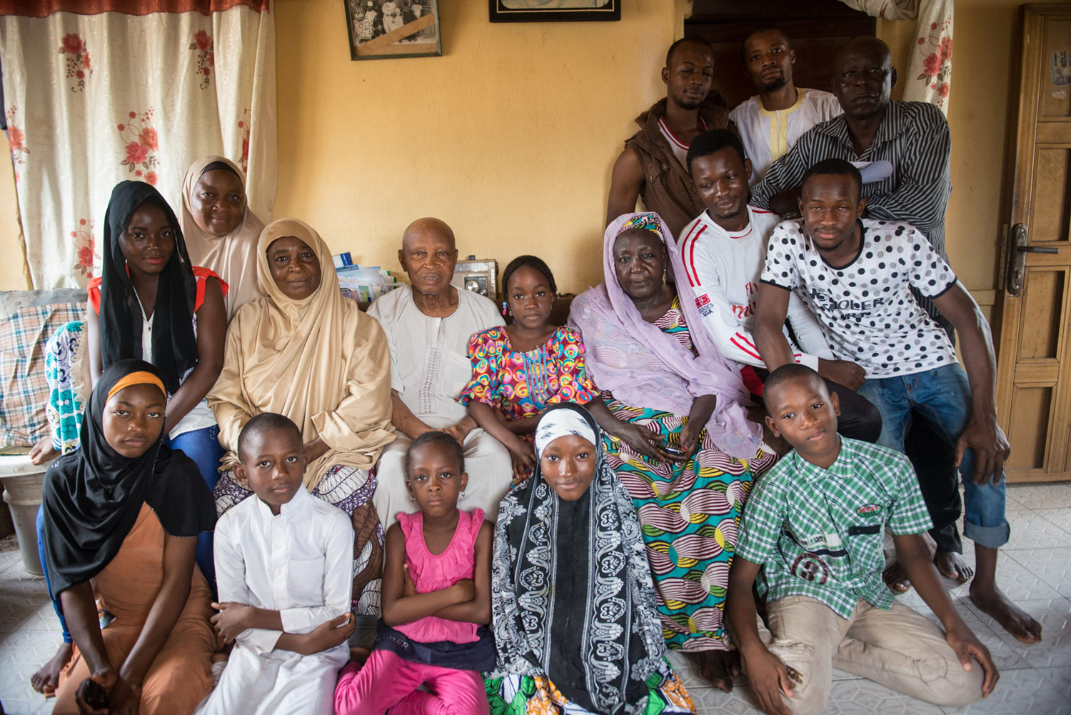  Ahmed Musa, a 93-year-old nut trader, second row, center, sits for a portrait with a small portion of his extensive family.  