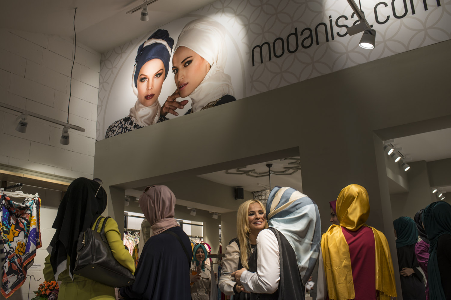  Fans gather at the Modanisa store to see Dubai based designer Rabia Z at the Umraniye store in Istanbul, Turkey.  