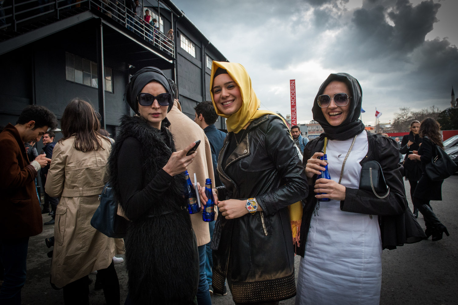  Attendees exit Istanbul Fashion Week in Istanbul Turkey 