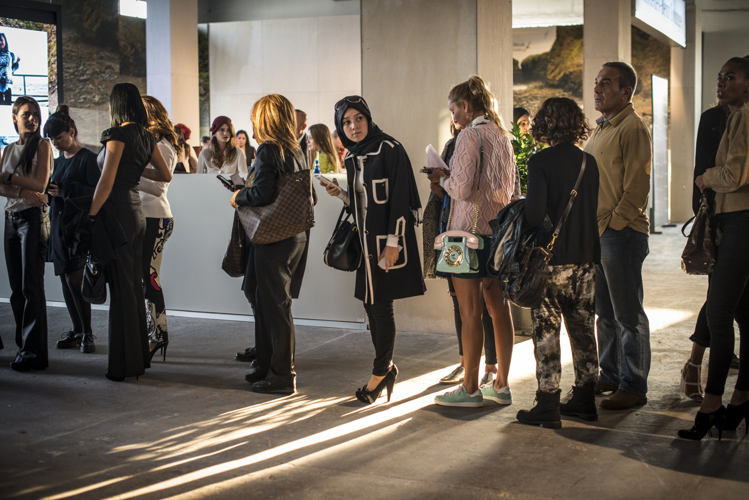  Show goers before the DB Berdan show at S/S 2015 Istanbul Fashion Week. 