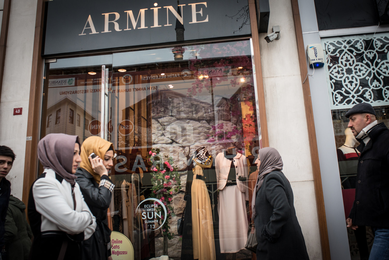  Shoppers walk past the Armine showroom. Armine- a high end Islamic fashion house rivals the designs of Hermes in the Middle East. 