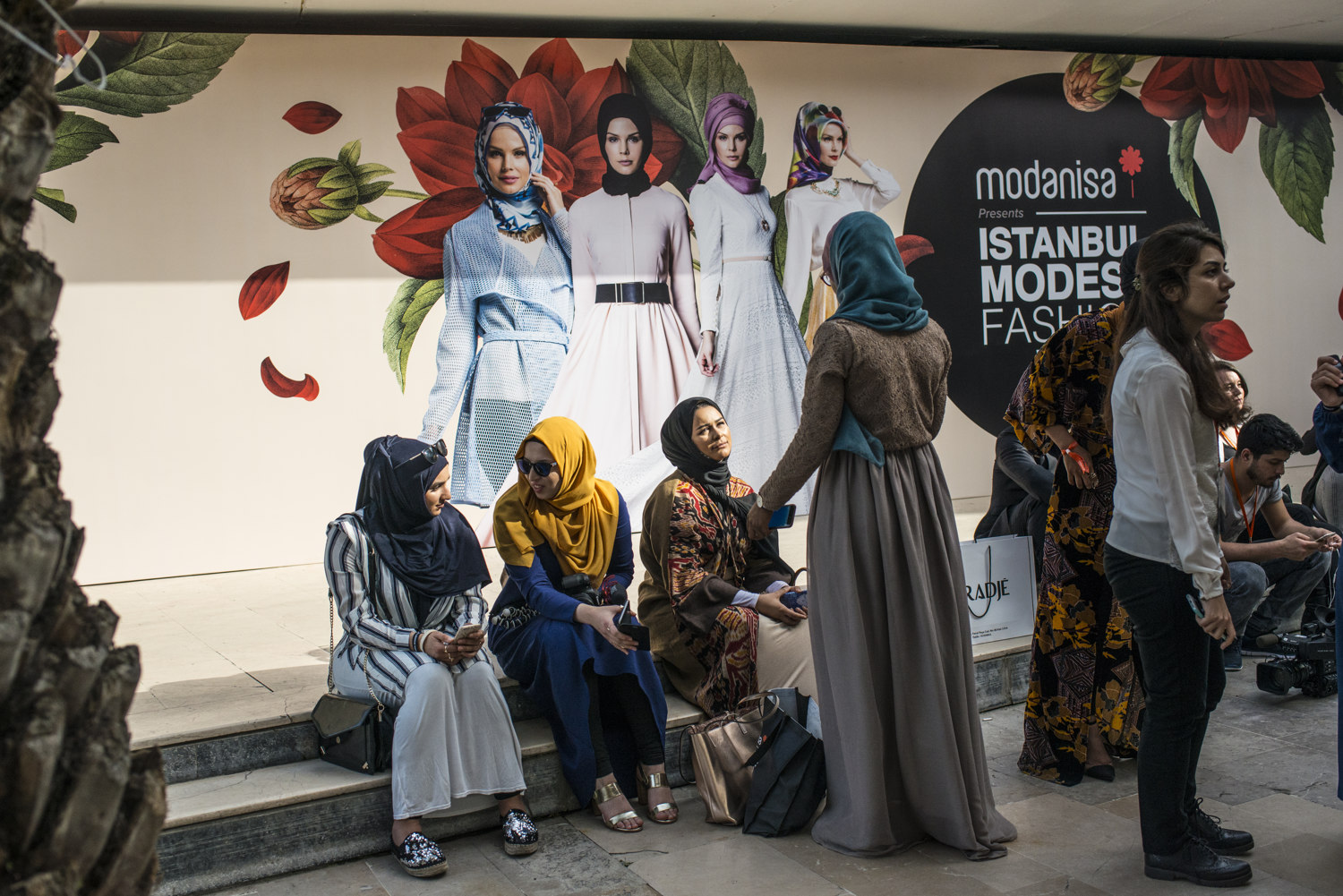  Women outside the shows at the first day of IMFW. 

Images from the first day of Modanisa's Istanbul Modest Fashion Week which takes place at Haydarpasa train station in Istanbul, Turkey on May 13th, 2016. 