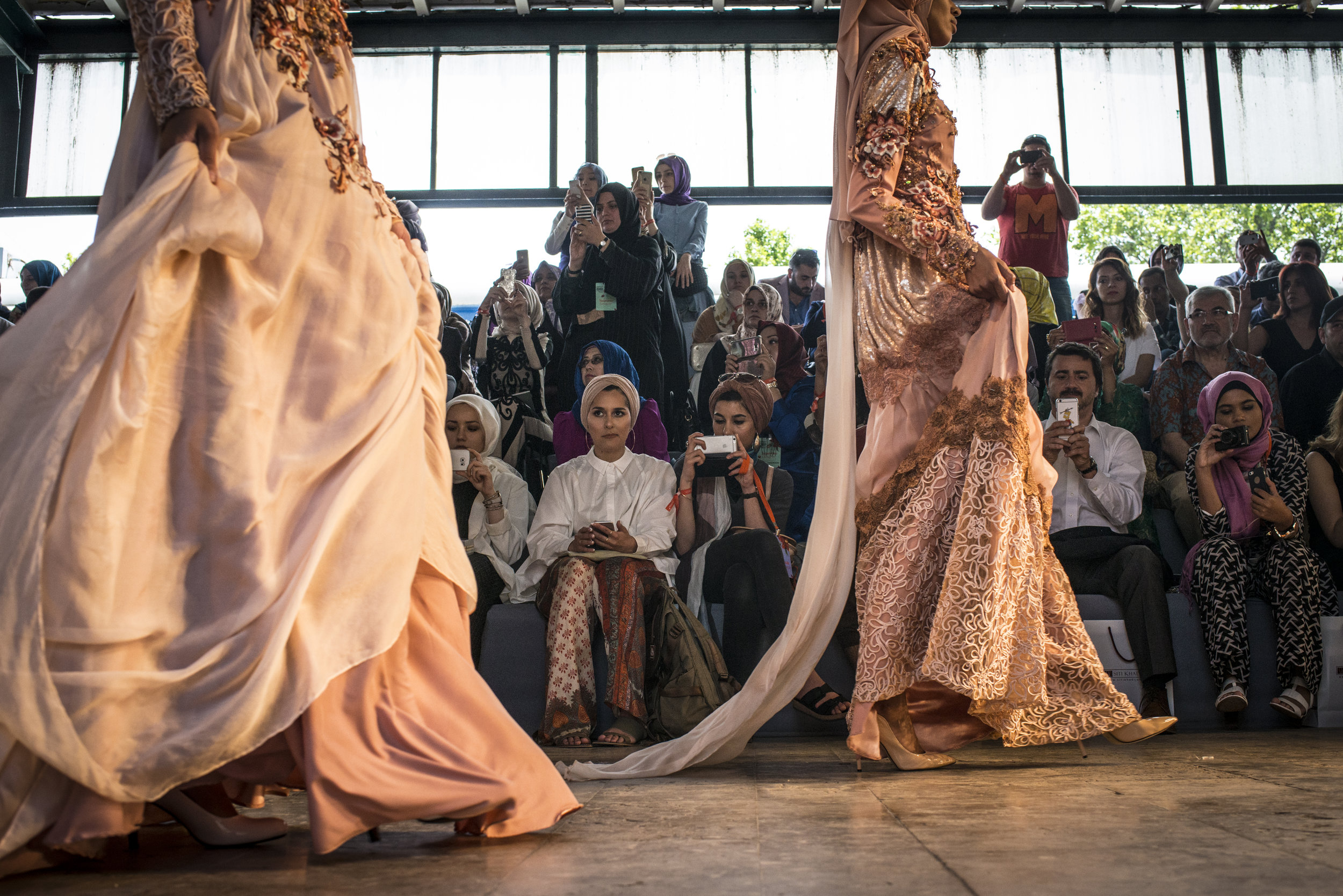  Blogger Dina Torkia watches the runway shows at Istanbul Modest Fashion Week by Modanisa which takes place at Haydarpasa train station in Istanbul, Turkey on May 14th, 2016. 