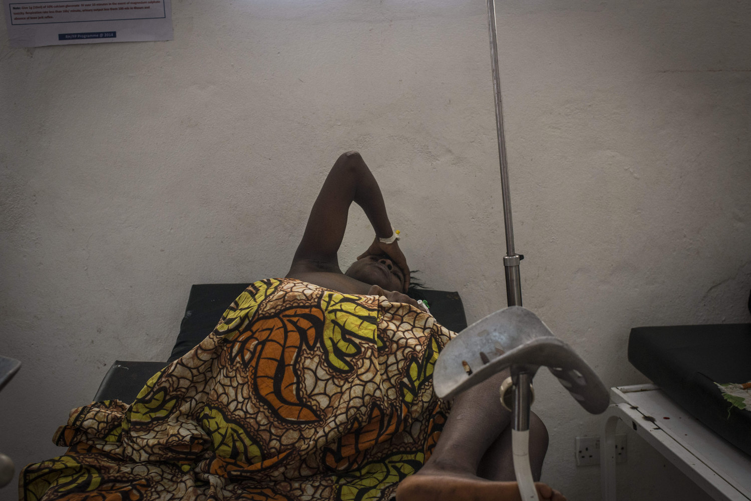  Kema rests after giving birth. Kema James, 18 delivers in the Kenema Goverment Hospital in Kenema, Sierra Leone. Kema's baby was born with sepsis. Kema rode for a half hour on a motorbike to reach the hospital. 