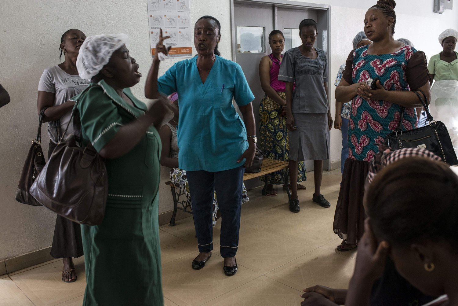  A prayer service starts off the morning in Kenema Goverment Hospital in Kenema, Sierra Leone on November 10th, 2015.  