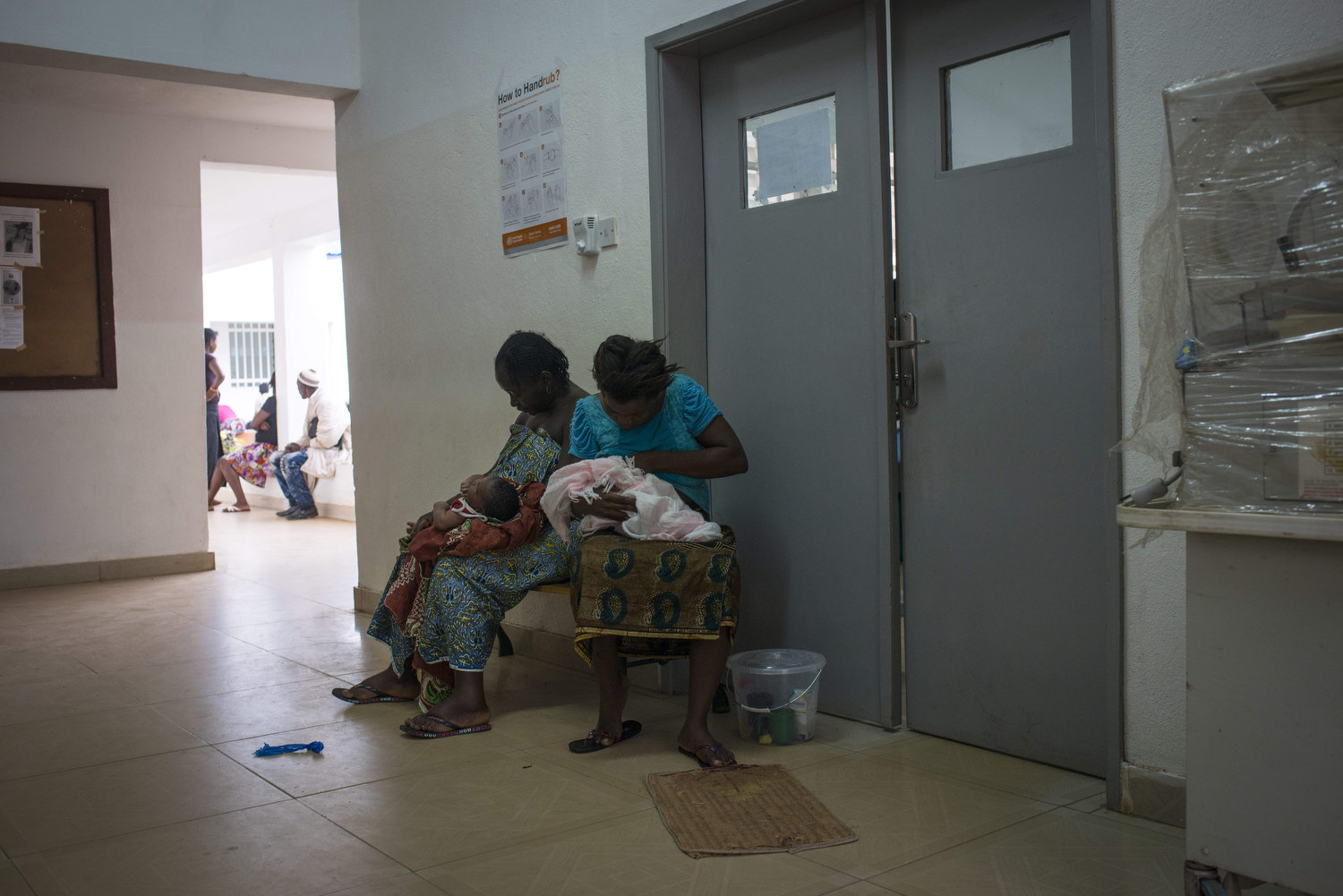  Nurses preform post- natal checkups on babies brought to the NICU ward. There they check the temperature and give injections. At Kenema Government Hospital in Kenema, Sierra Leone on November 10th, 2015.  